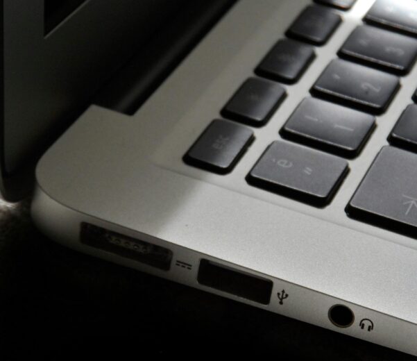 Free Detailed view of a silver laptop showing keyboard and multiple ports. Stock Photo